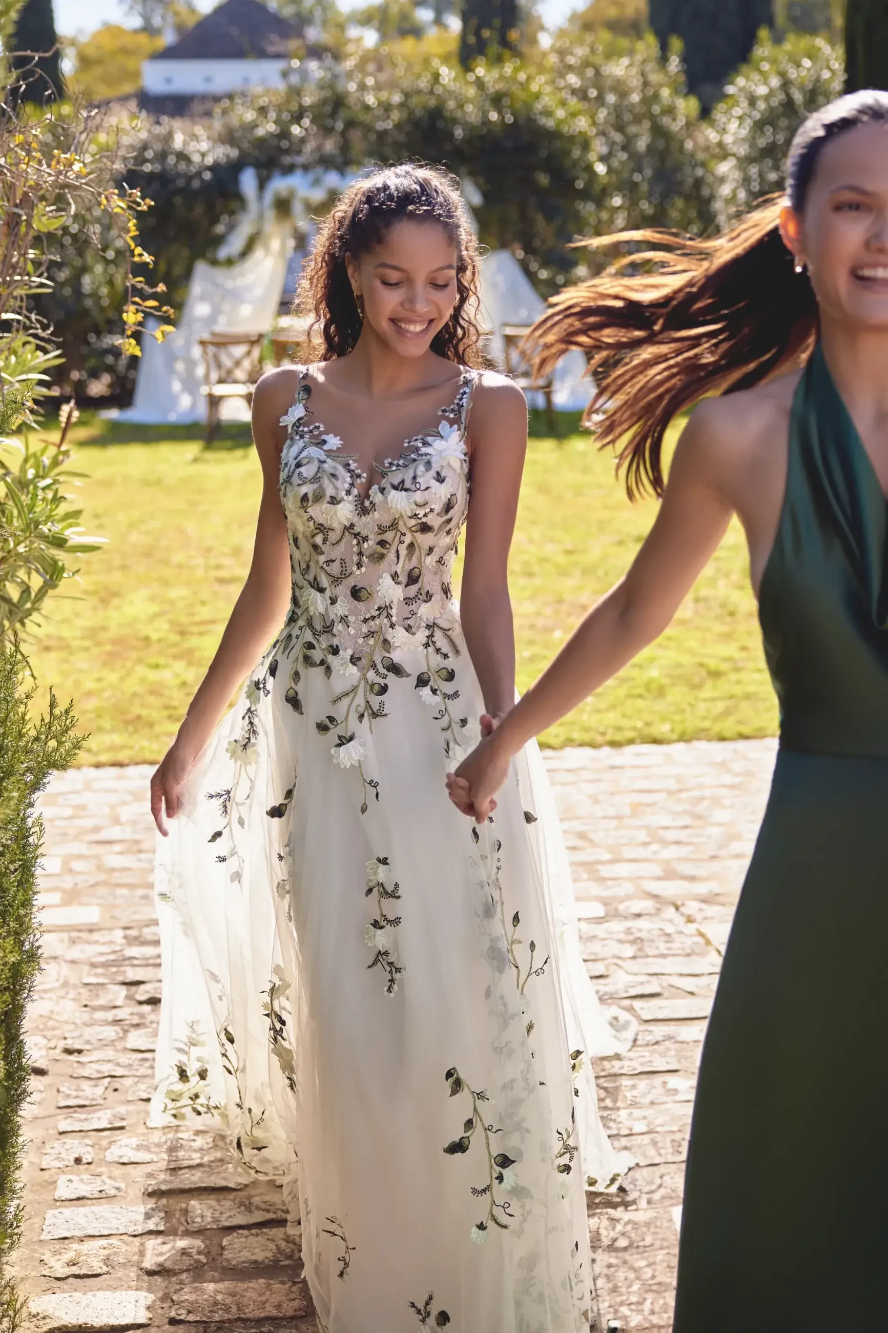 model is wearing an a-line multicolored wedding gown