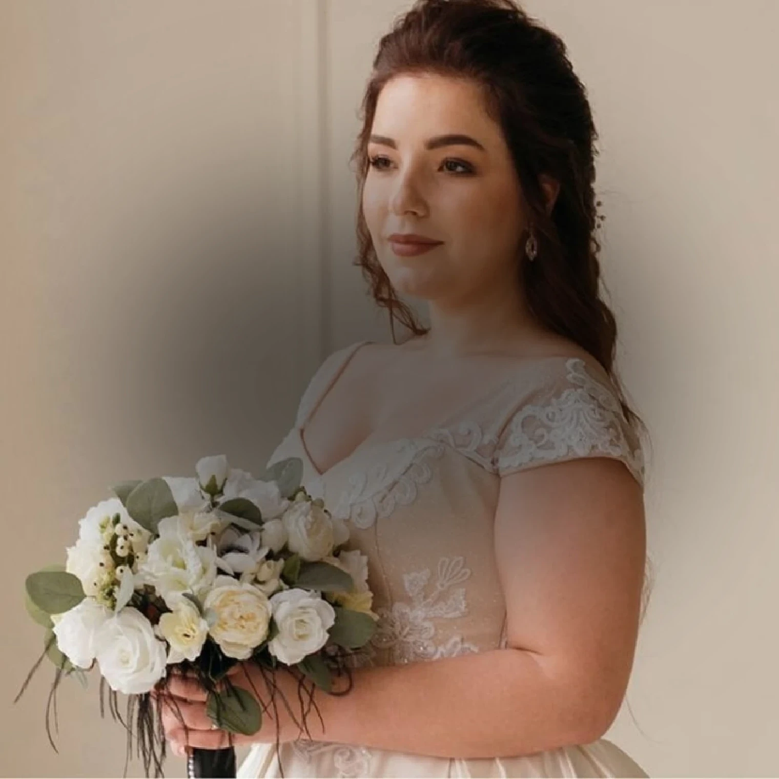 Сouple wearing a blue gown and a black suit. Mobile image