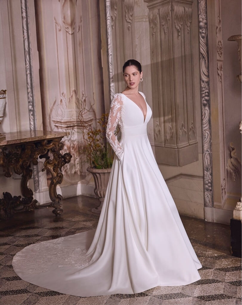 Models wearing a gown by Justin AleXander