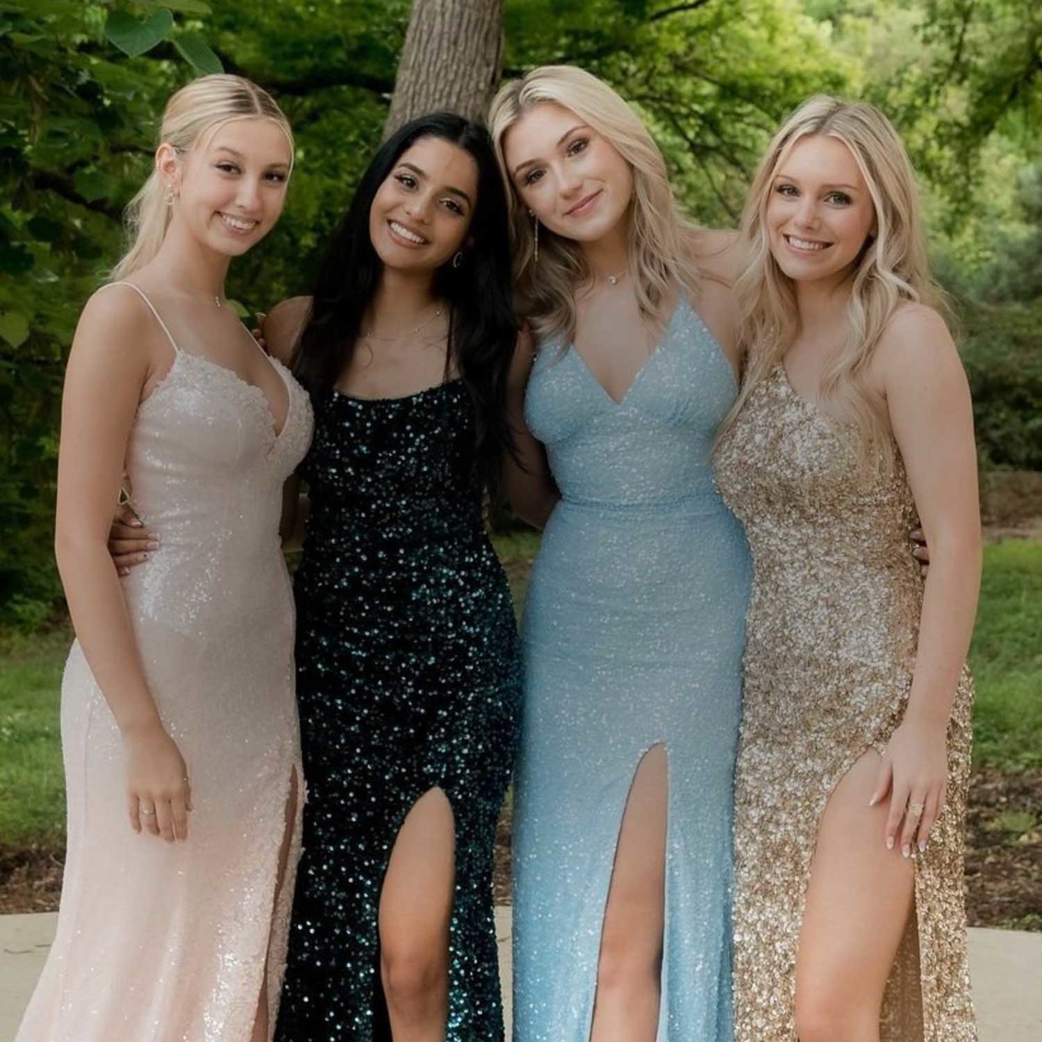 Сouple wearing a blue gown and a black suit. Mobile image