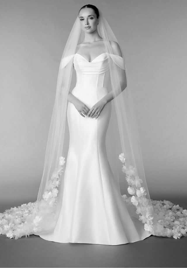 Model wearing a purple dress