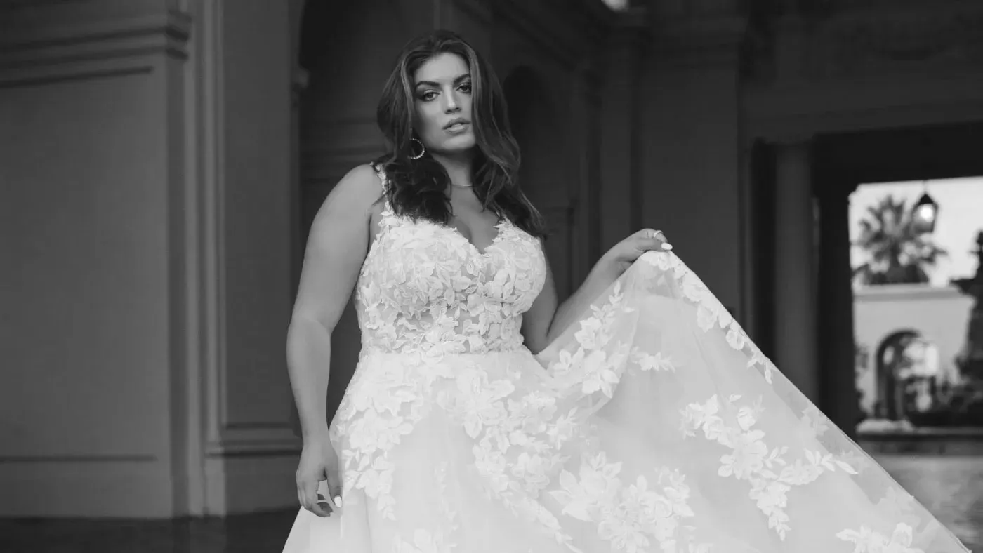 Model wearing plus size wedding gown