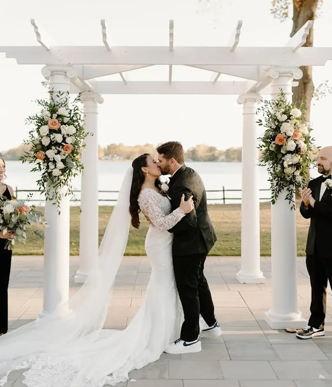 Сouple wearing a white gown and a black suit