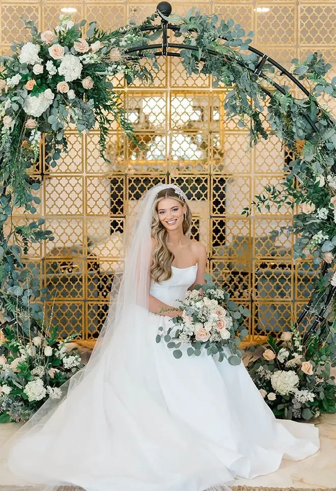 Model wearing a white gown